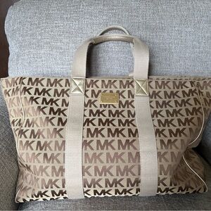 Michael Kors Tan Monogram Duffel Bag this is a womans duffle bag
